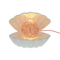 Muschellampe mit buntem Glitzer